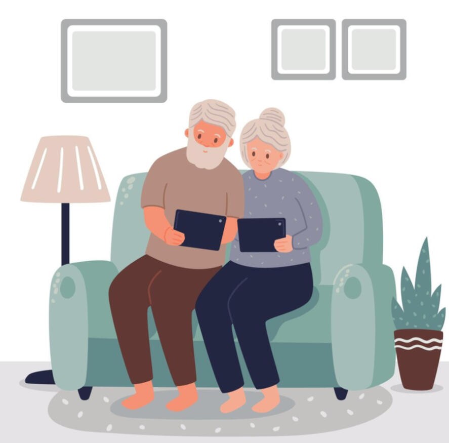 Senior couple sitting on a couch with tablets